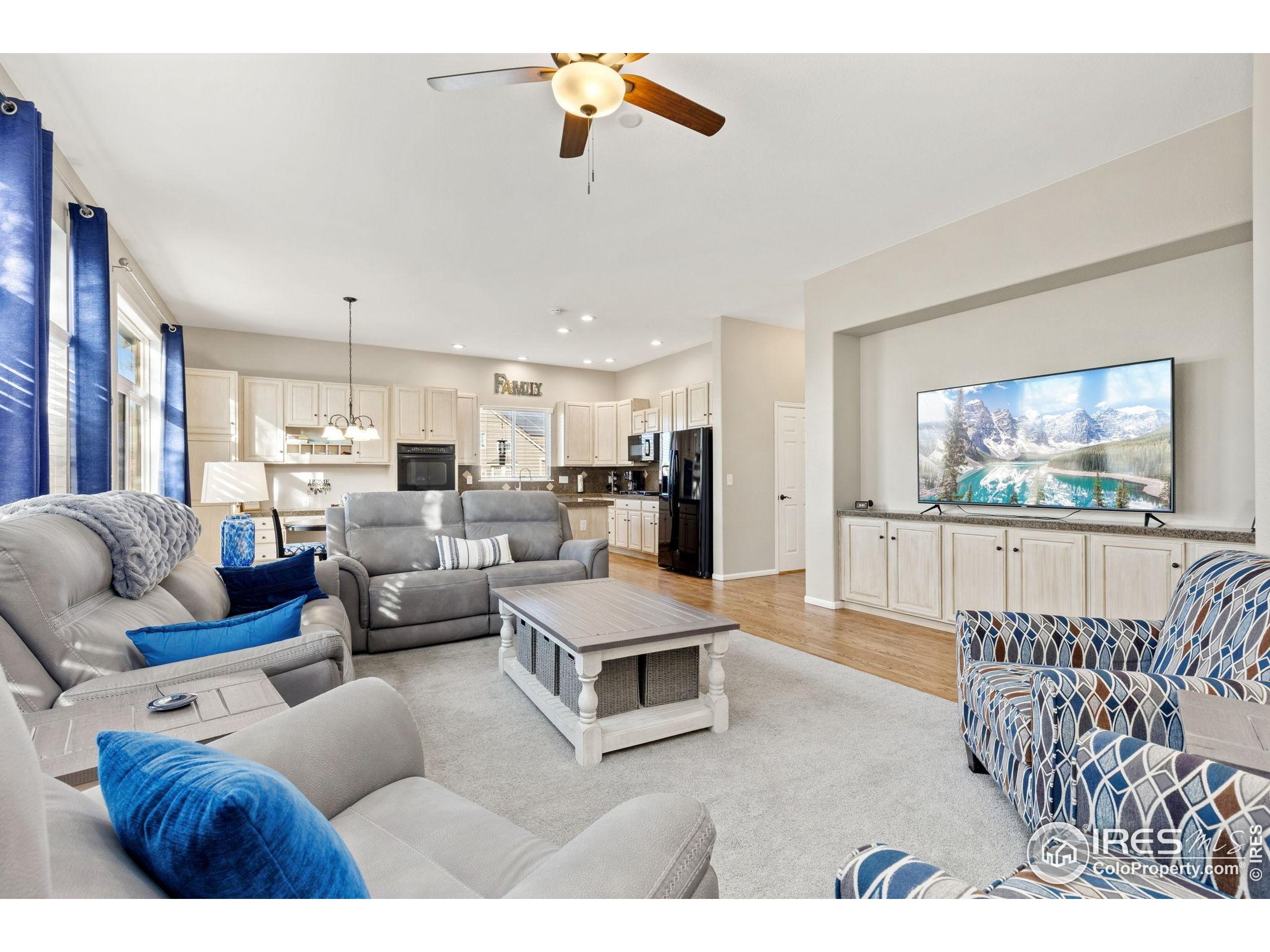 10166 Scenic Court Firestone, CO 80504 - Photo 14 of 33 a living room with furniture and a flat screen tv