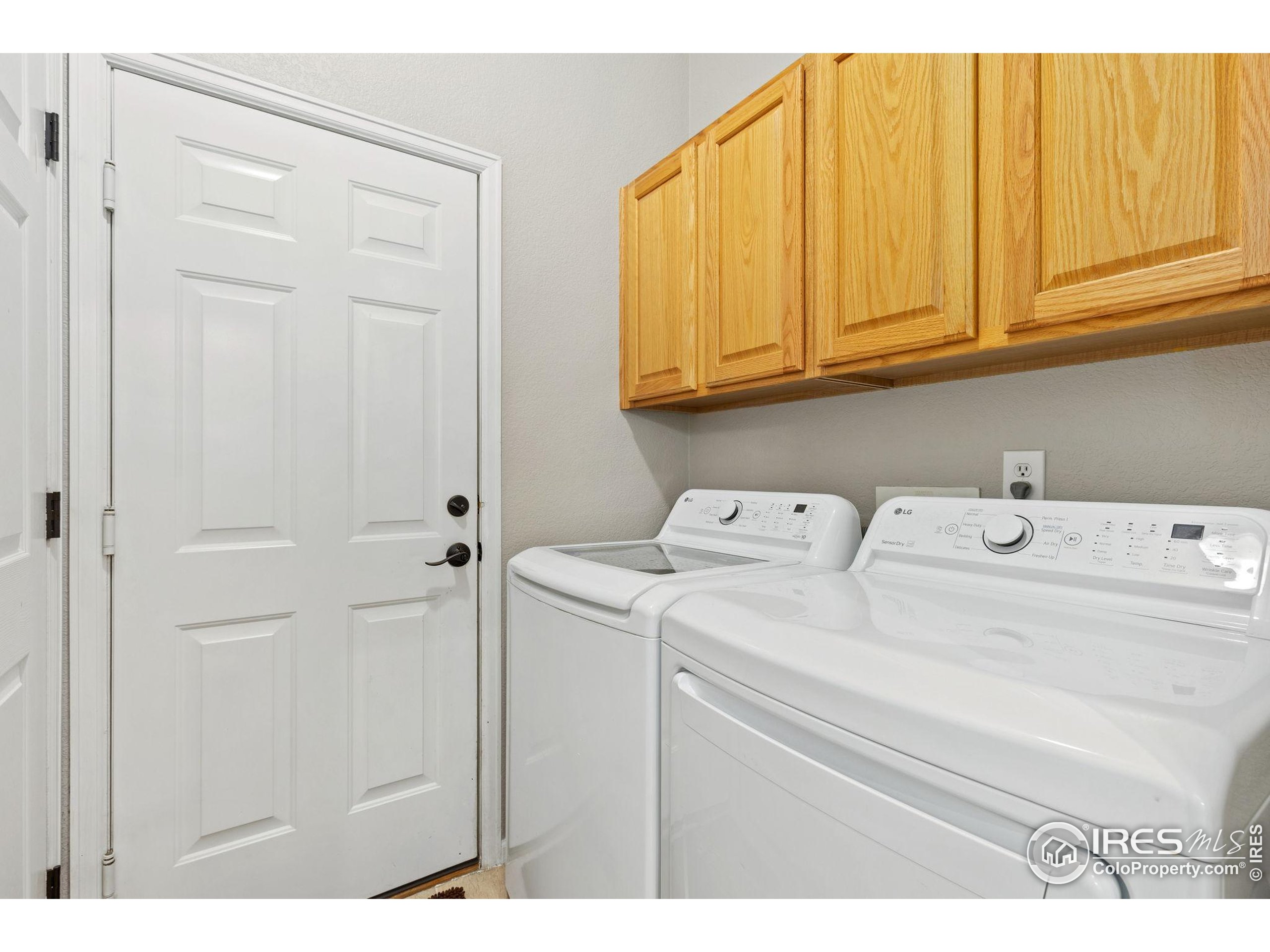 10166 Scenic Court Firestone, CO 80504 - Photo 21 of 33 a utility room with dryer and washer