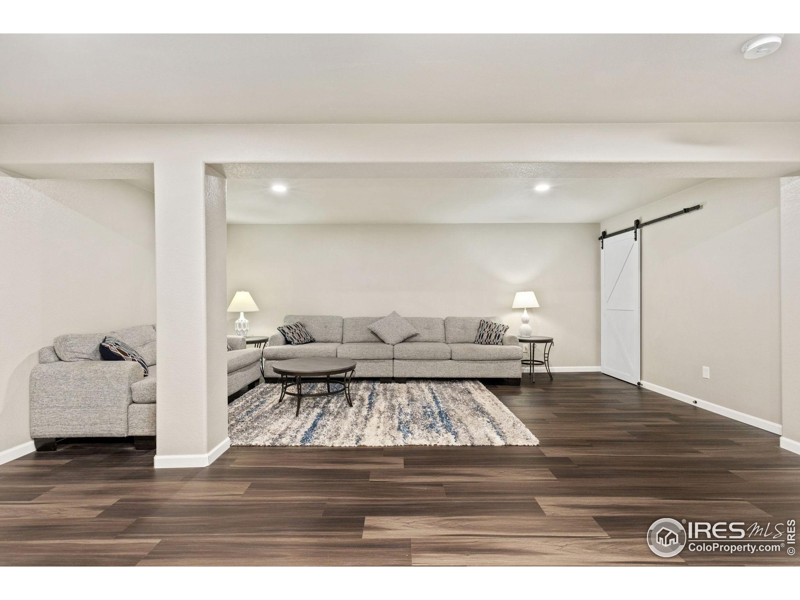 10166 Scenic Court Firestone, CO 80504 - Photo 25 of 33 a living room with furniture and a table
