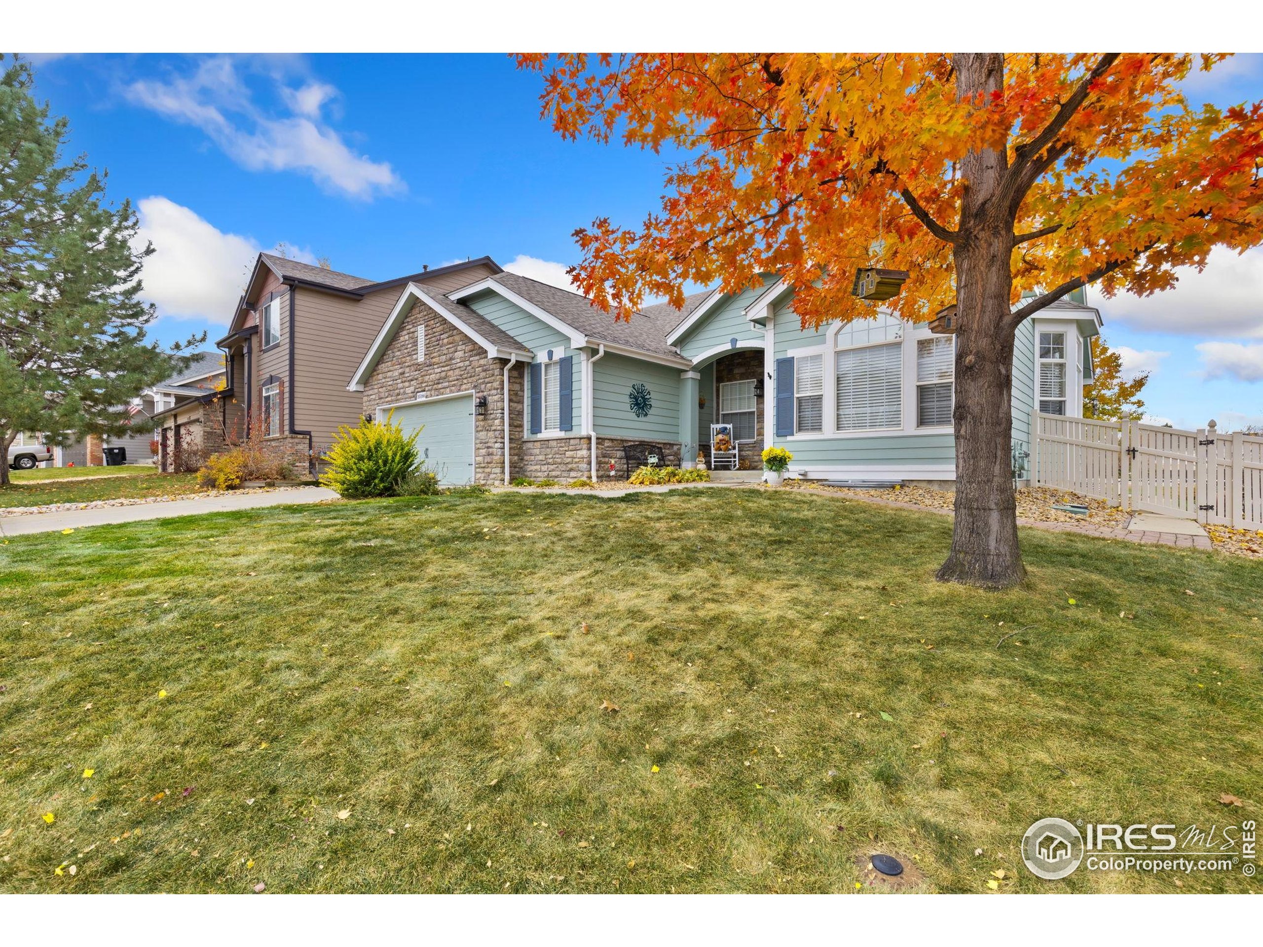 10166 Scenic Court Firestone, CO 80504 - Photo 4 of 33 a front view of a house with a yard