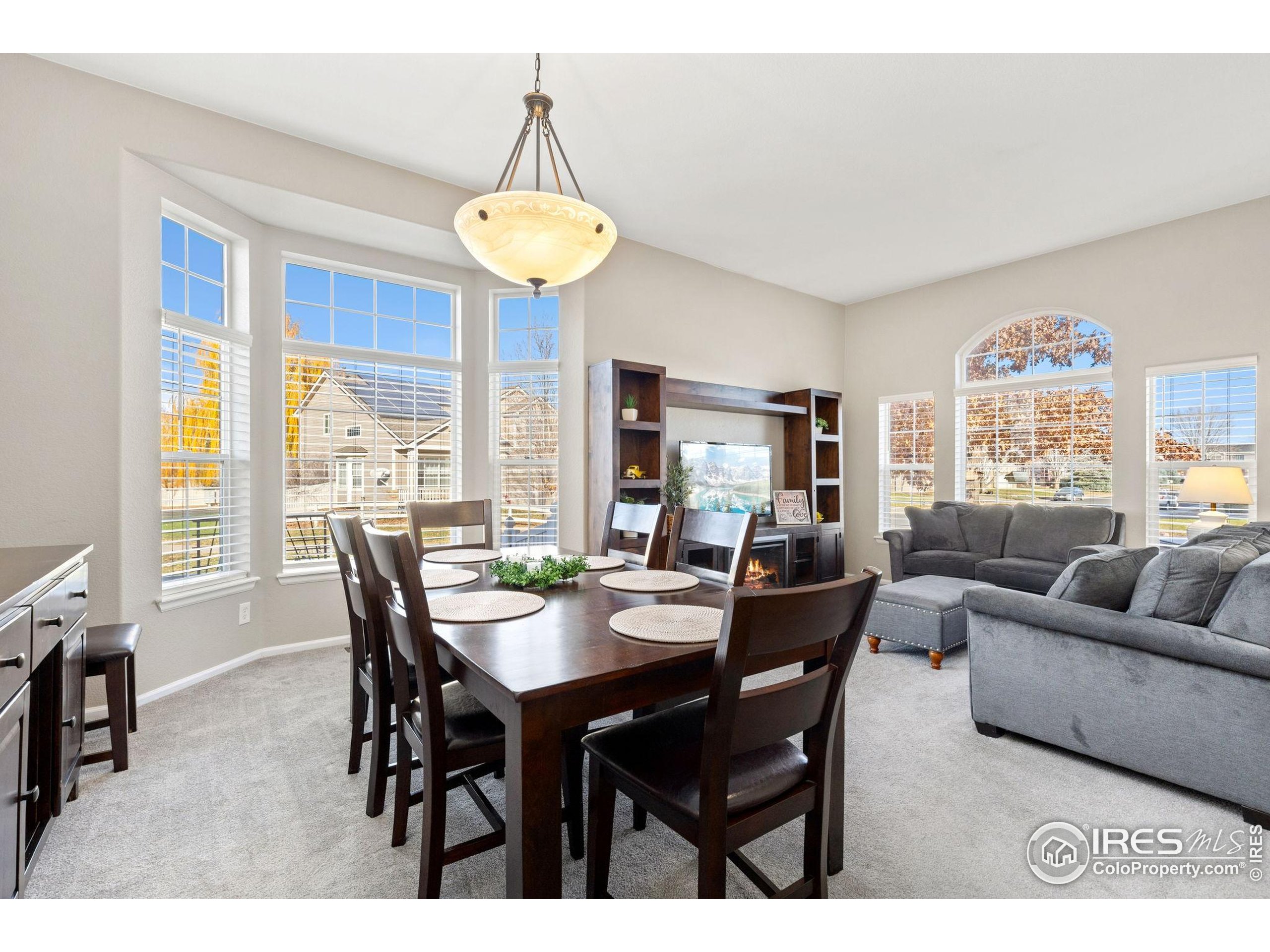 10166 Scenic Court Firestone, CO 80504 - Photo 7 of 33 a view of a dining room with furniture and a large window