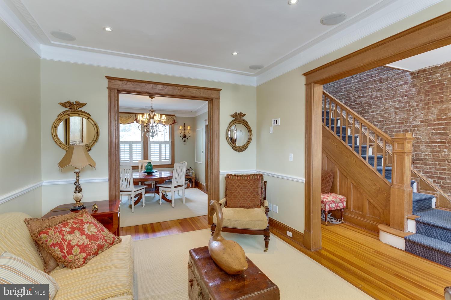 1654 33rd Street Northwest Washington, DC 20007 - Photo 1 of 17 a living room with furniture and a floor to ceiling window