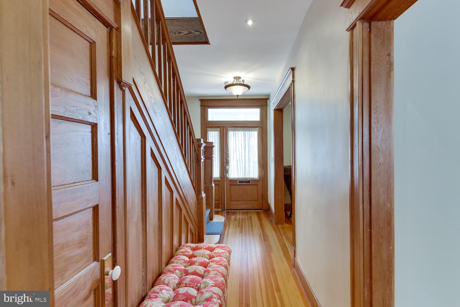 1654 33rd Street Northwest Washington, DC 20007 - Photo 12 of 17 a view of a hallway with wooden floor and staircase