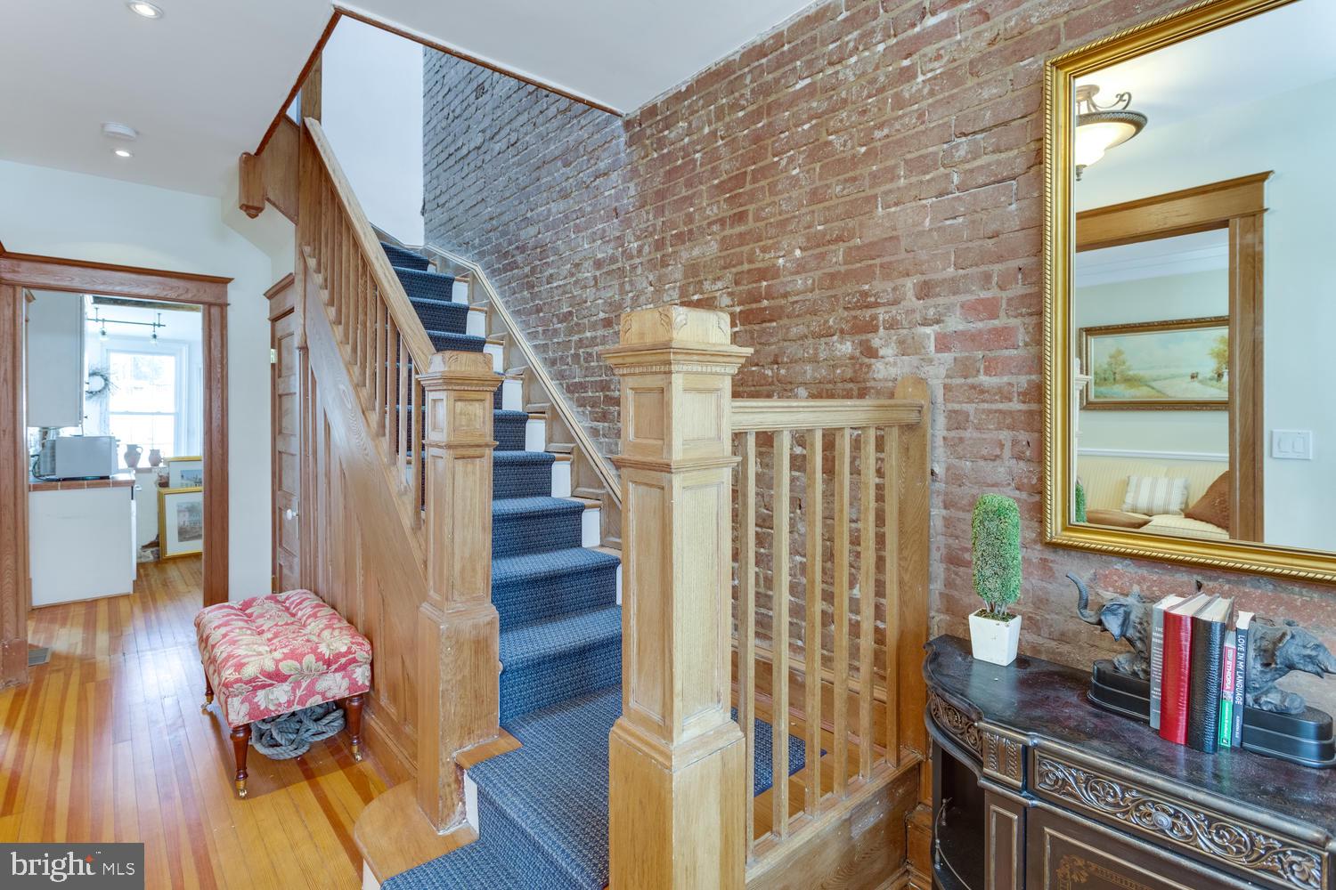 1654 33rd Street Northwest Washington, DC 20007 - Photo 13 of 17 a view of entryway and hall with wooden floor