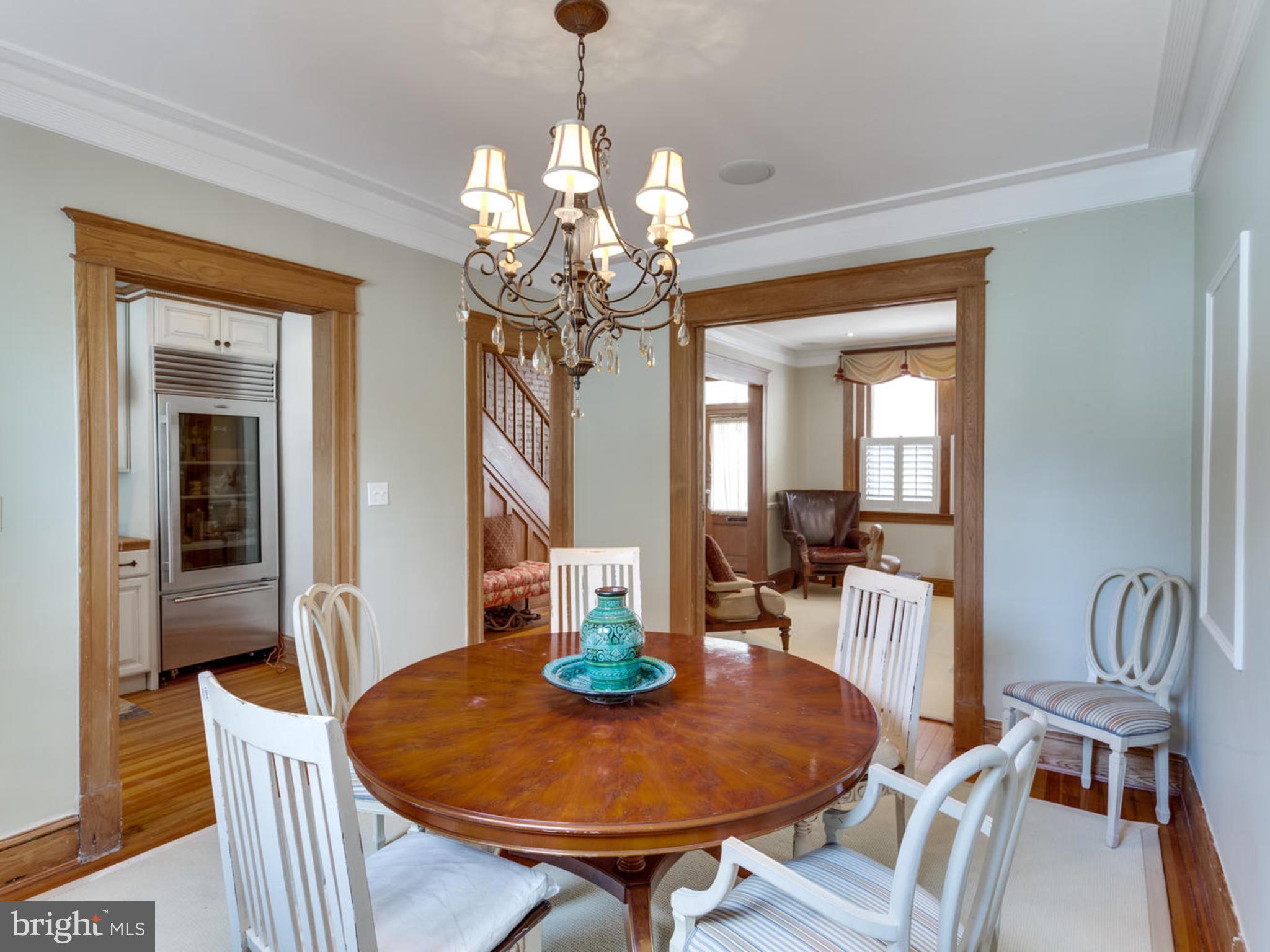 1654 33rd Street Northwest Washington, DC 20007 - Photo 7 of 17 a view of a dining room with furniture wooden floor and chandelier