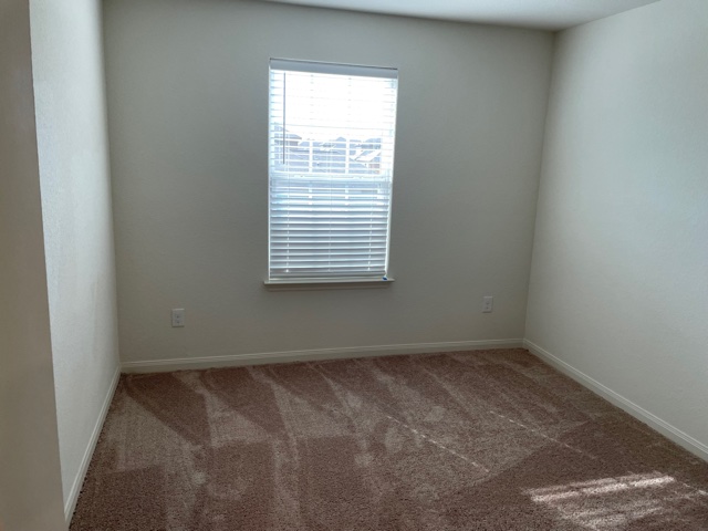 18812 Speculator Lane Elgin, TX 78621 - Photo 17 of 24 Carpeted empty room featuring baseboards