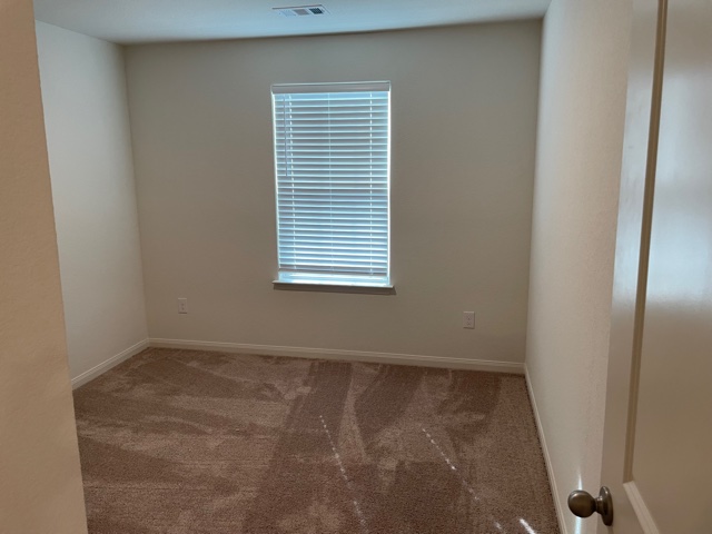 18812 Speculator Lane Elgin, TX 78621 - Photo 18 of 24 Carpeted spare room featuring baseboards