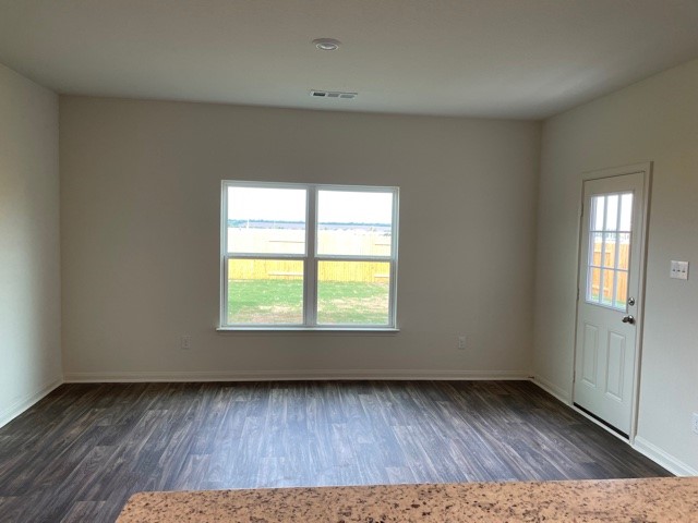 18812 Speculator Lane Elgin, TX 78621 - Photo 19 of 24 Foyer featuring dark wood-type flooring and baseboards