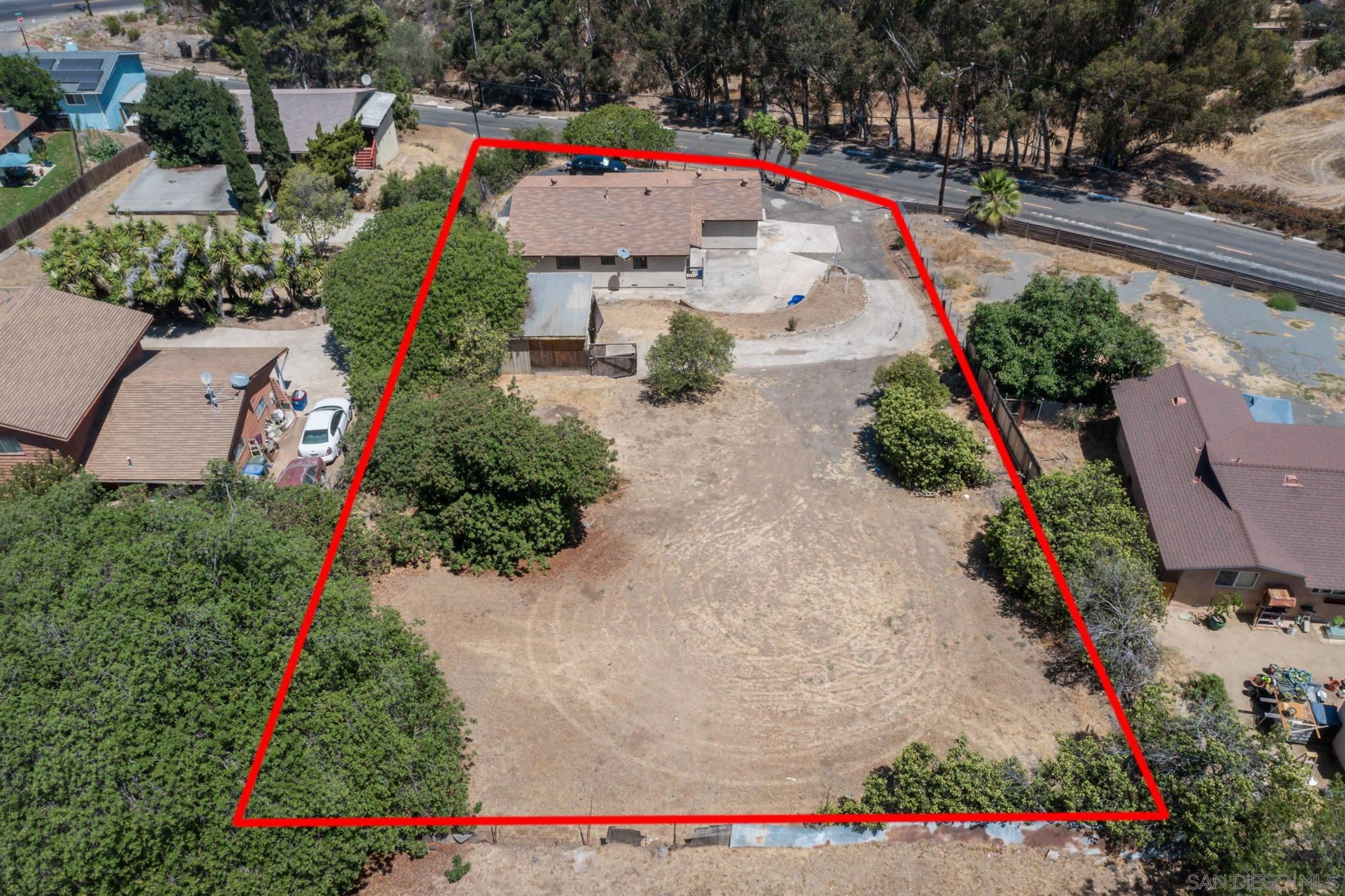 an aerial view of house and yard