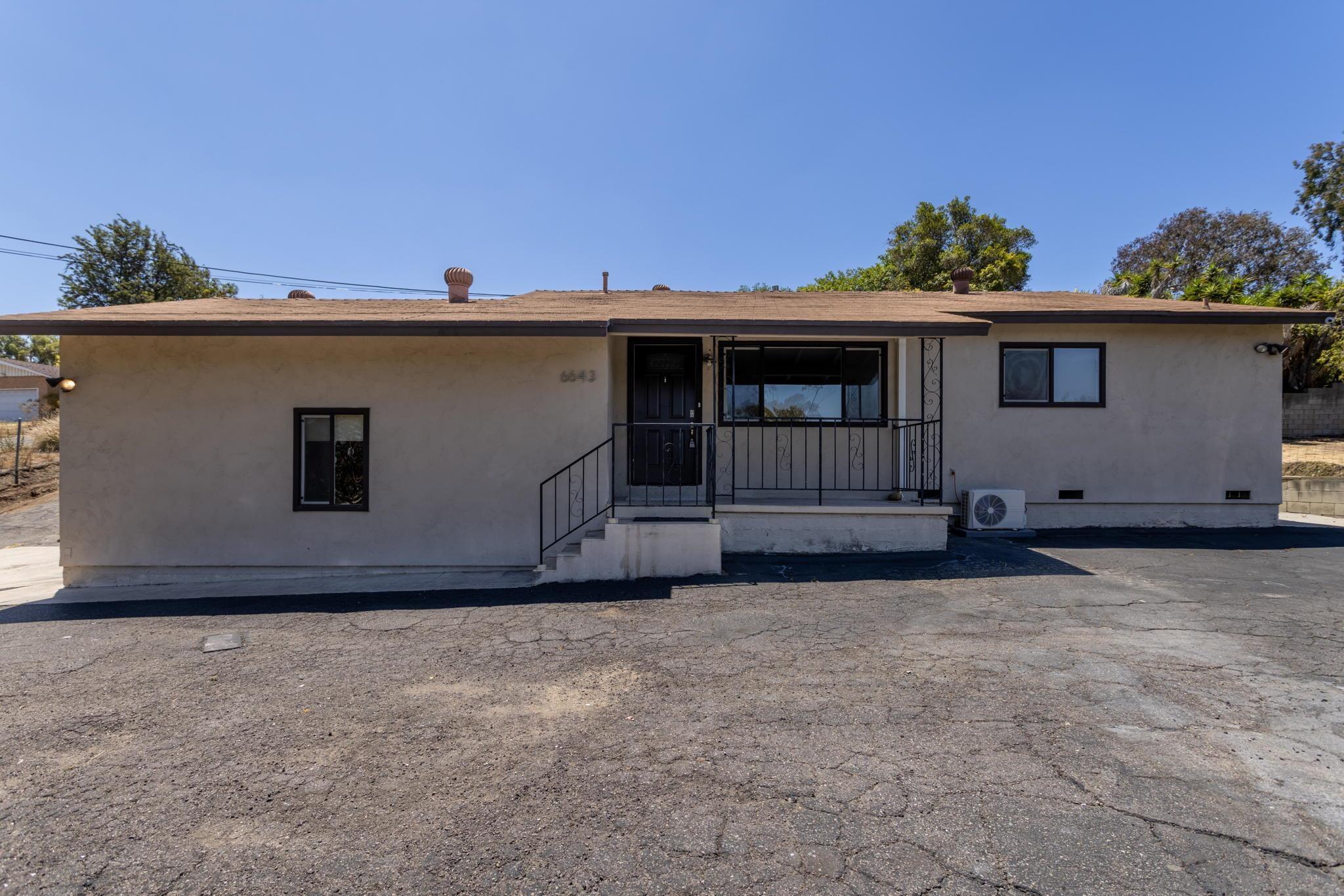 6643 San Miguel Lemon Grove, CA 91945 - Photo 11 of 34 a view of a house with a yard