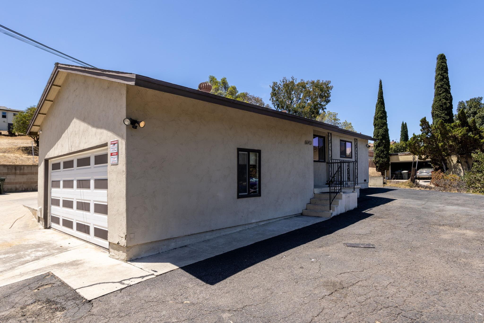 6643 San Miguel Lemon Grove, CA 91945 - Photo 12 of 34 a view of a house with a yard