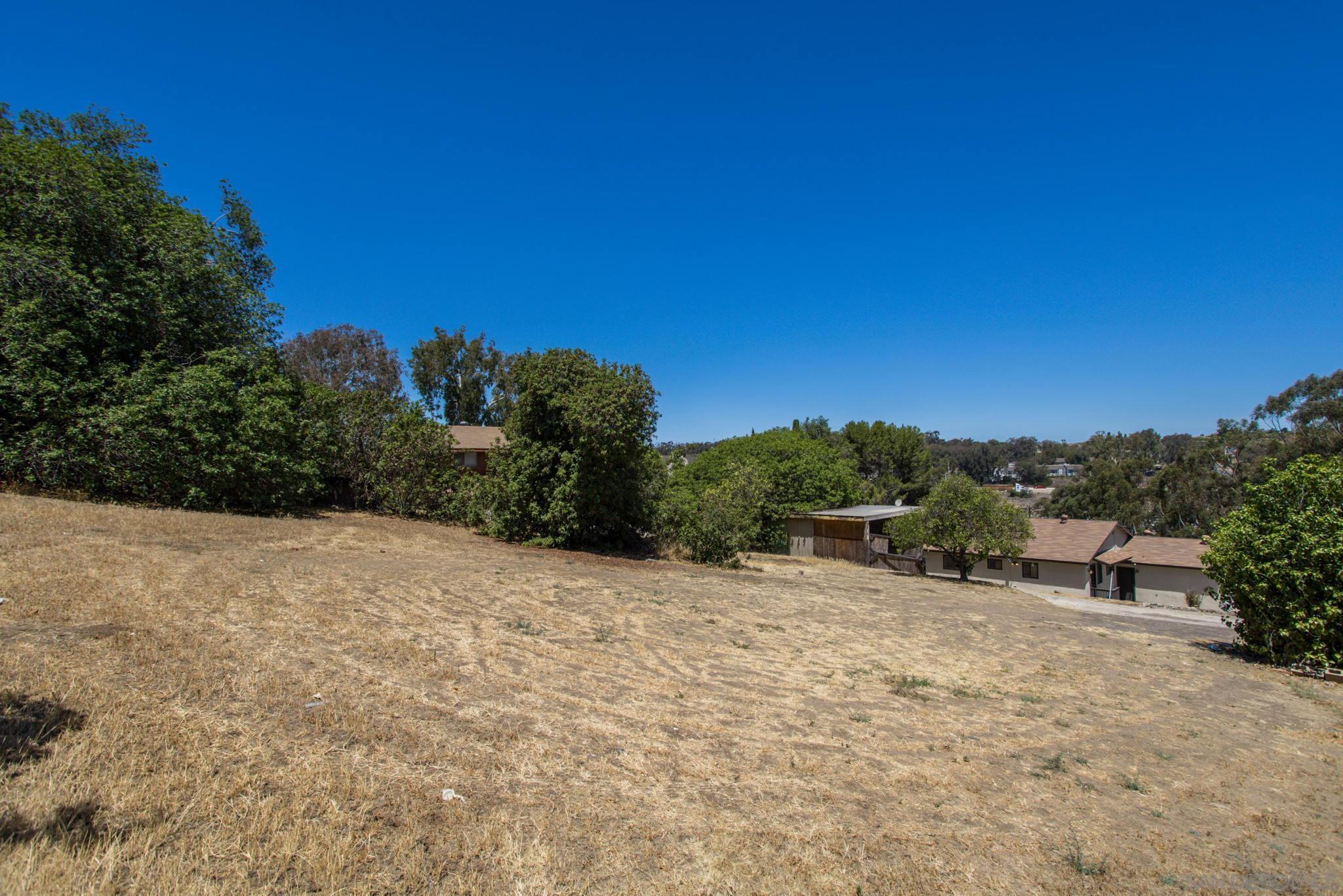 6643 San Miguel Lemon Grove, CA 91945 - Photo 14 of 34 a view of a dry yard with trees