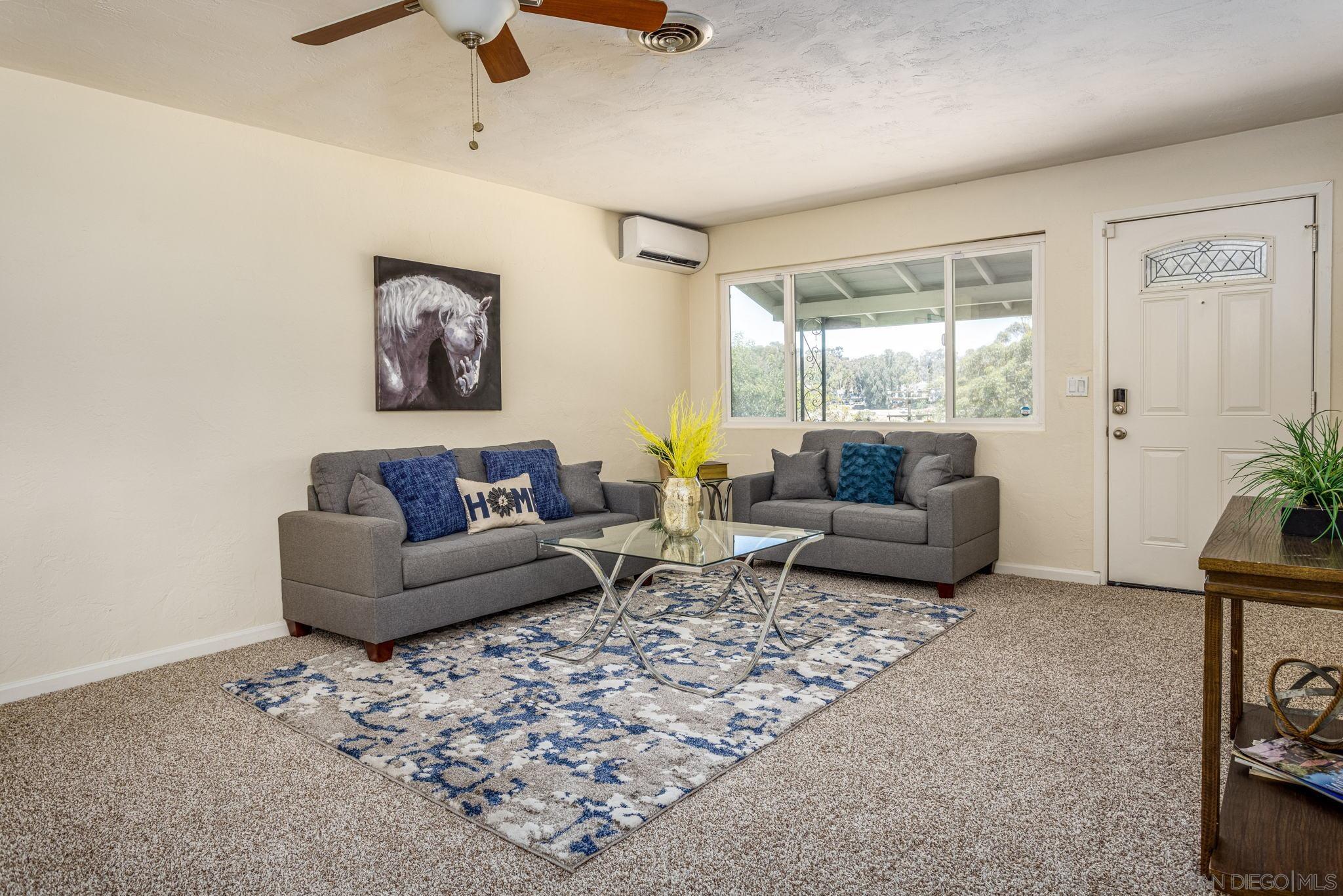 6643 San Miguel Lemon Grove, CA 91945 - Photo 18 of 34 a living room with furniture and a window
