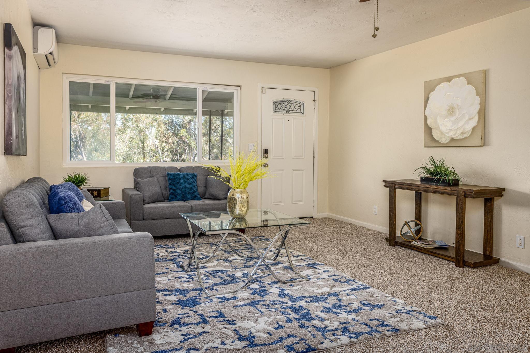 6643 San Miguel Lemon Grove, CA 91945 - Photo 19 of 34 a living room with furniture and a window