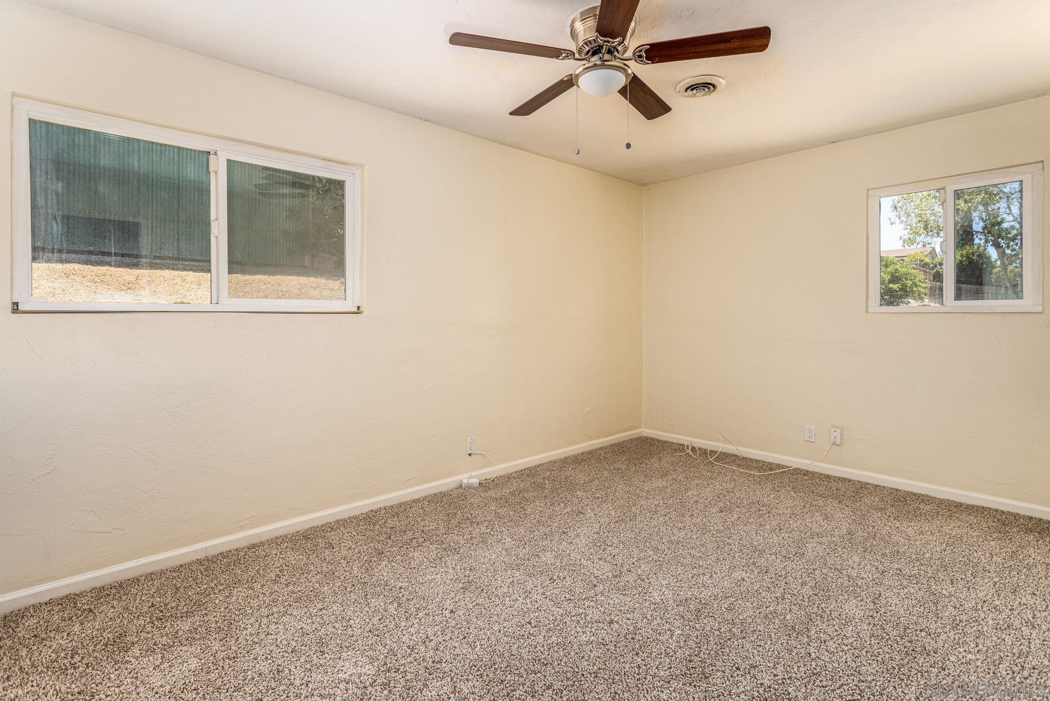 6643 San Miguel Lemon Grove, CA 91945 - Photo 29 of 34 an empty room with a window and a fan