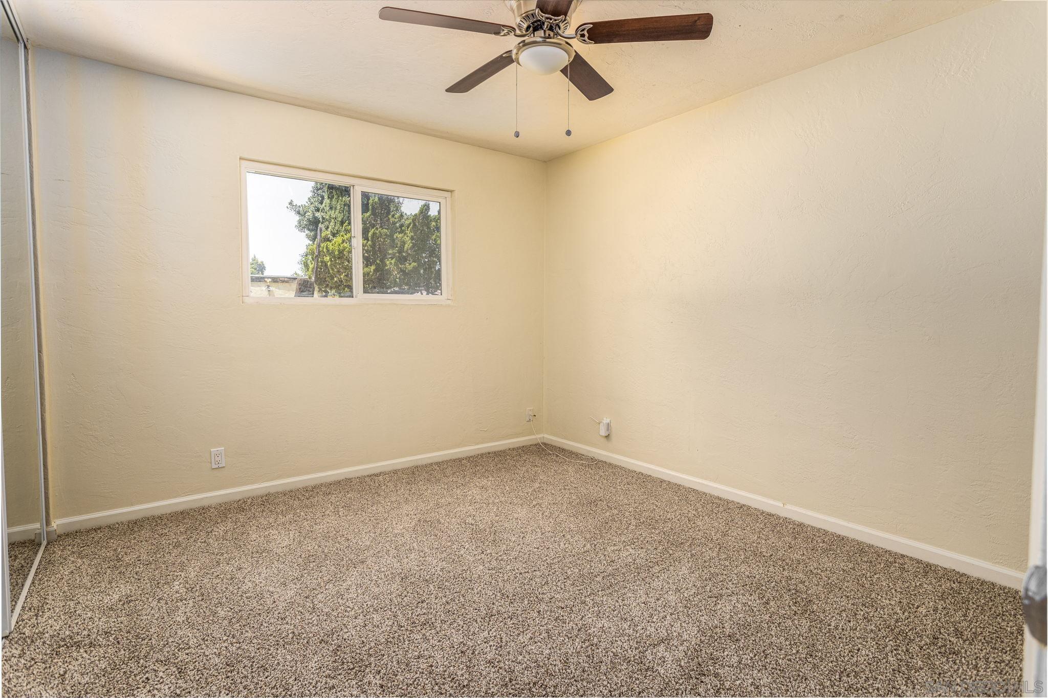 6643 San Miguel Lemon Grove, CA 91945 - Photo 30 of 34 an empty room with a window and a fan
