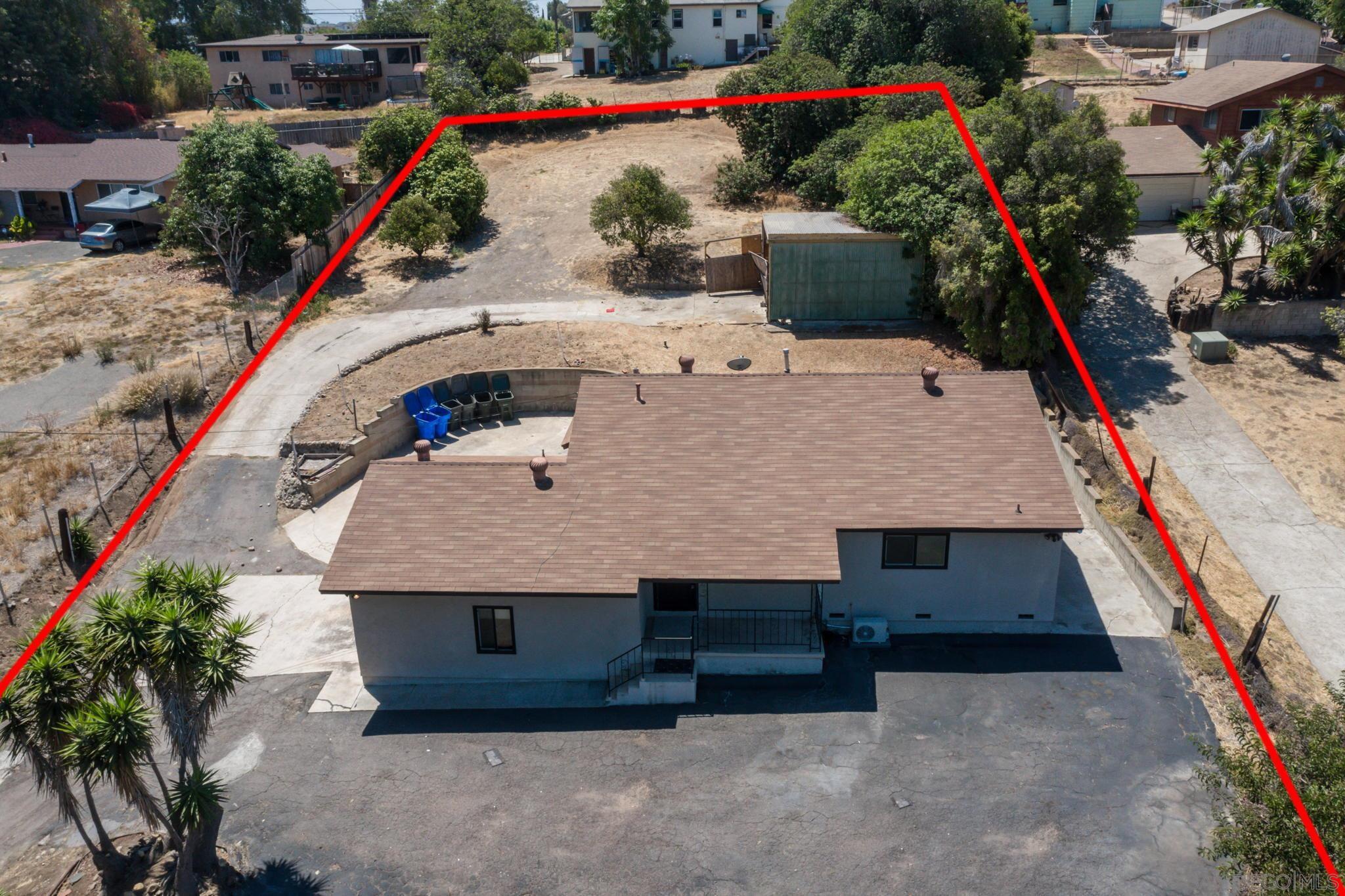 6643 San Miguel Lemon Grove, CA 91945 - Photo 9 of 34 an aerial view of a house with a yard and a large tree