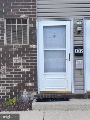 a view of a brick house with a window