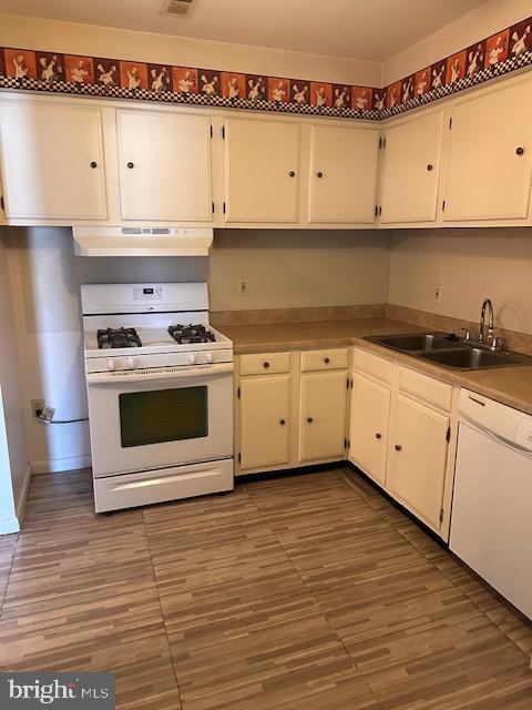 2900 State Hill Road, Unit I12 Reading, PA 19610 - Photo 7 of 14 a white kitchen with granite countertop stainless steel appliances
