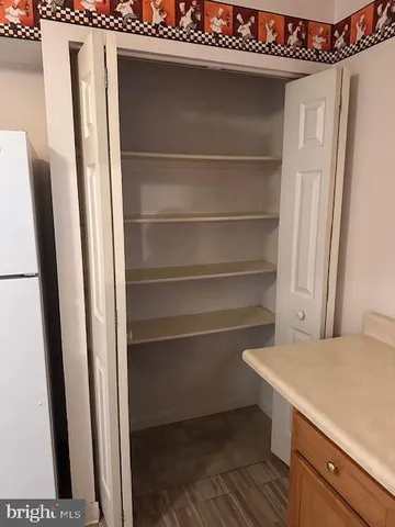 a view of storage and utility room with washer and dryer