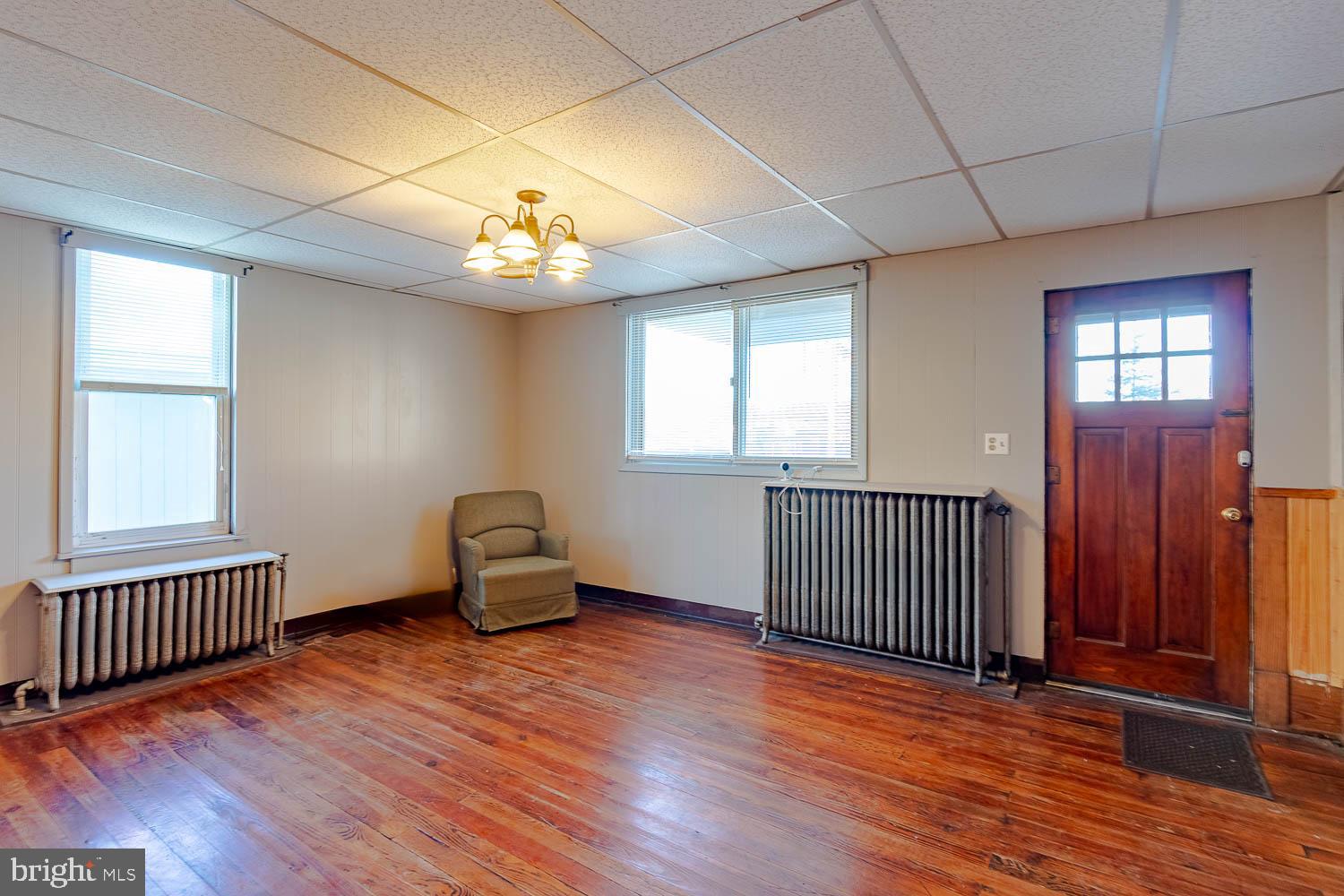 200 Stumptown Road Osceola Mills, PA 16666 - Photo 7 of 30 wooden floor in an empty room with a window