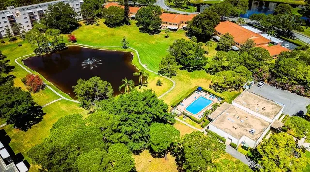 a view of green field with house in the background