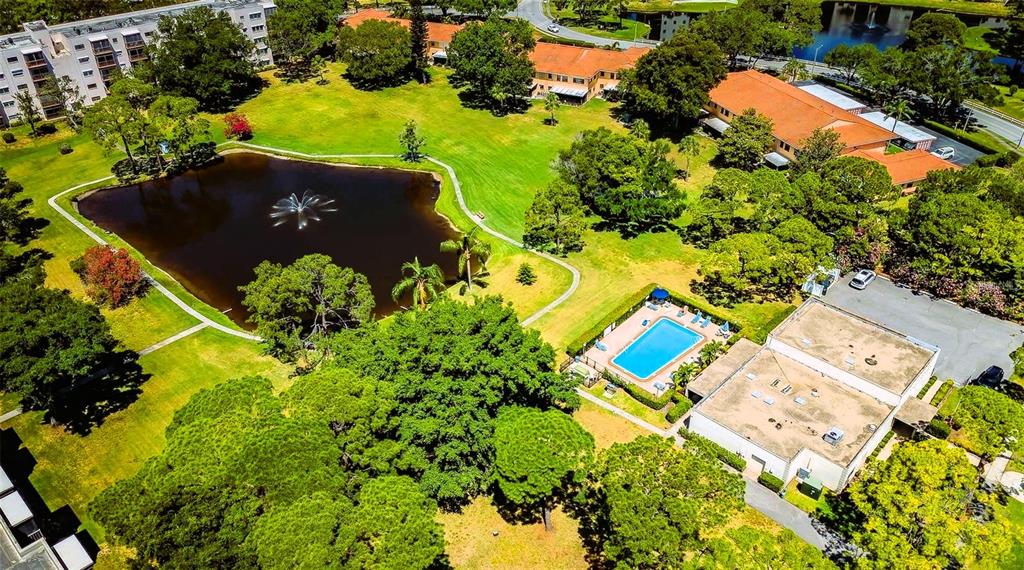 5660 80th Street North, Unit A303 St. Petersburg, FL 33709 - Photo 32 of 72 an aerial view of a residential houses with yard