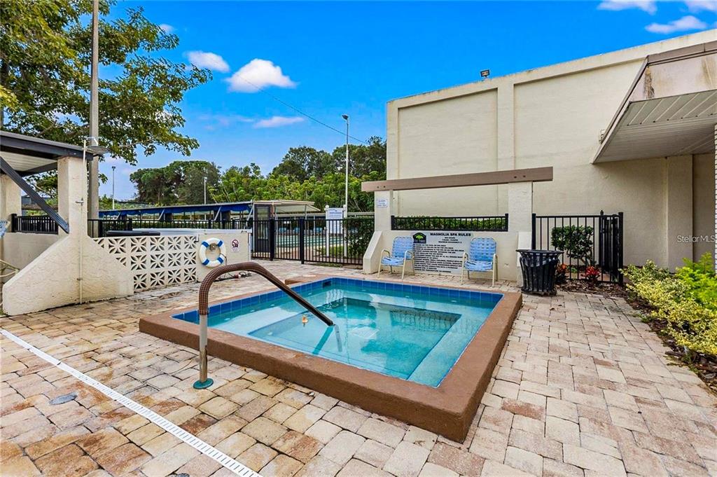 5660 80th Street North, Unit A303 St. Petersburg, FL 33709 - Photo 39 of 72 a view of small pool with seating area