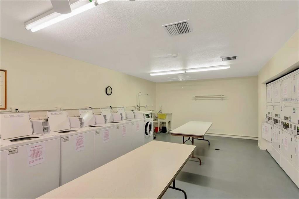 5660 80th Street North, Unit A303 St. Petersburg, FL 33709 - Photo 52 of 72 a room with furniture and white walls