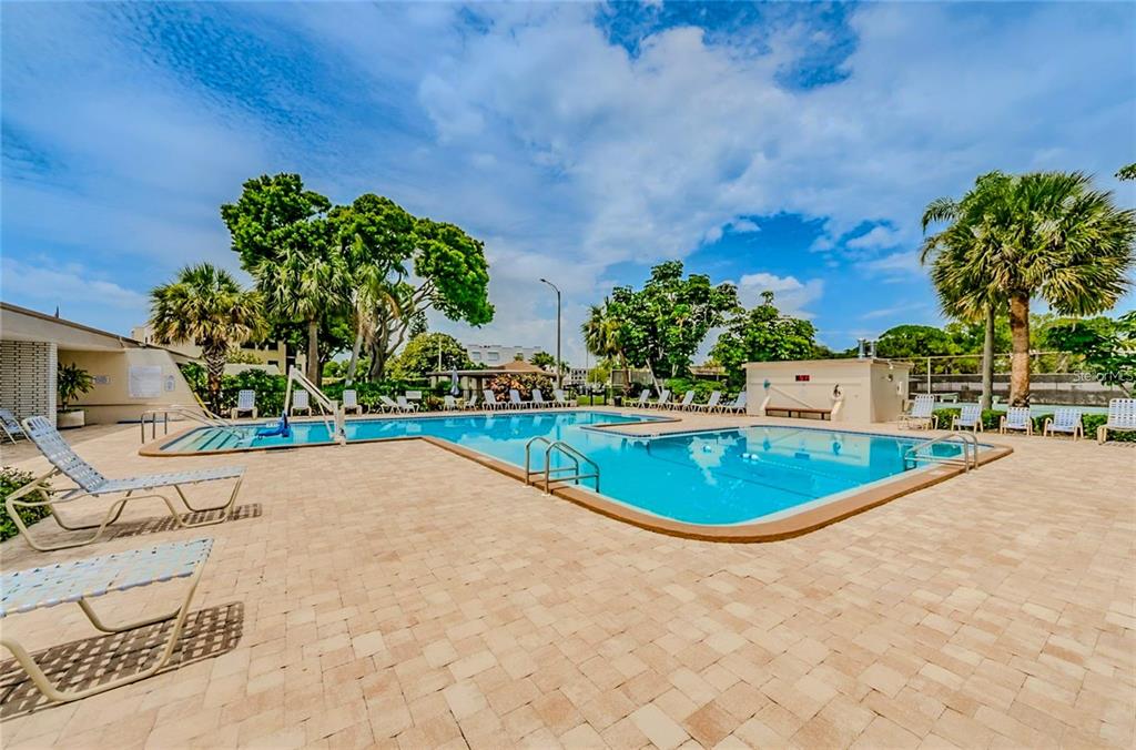 5660 80th Street North, Unit A303 St. Petersburg, FL 33709 - Photo 69 of 72 a view of outdoor space and swimming pool