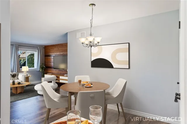 an empty room with wooden floor cabinet and ceiling fan