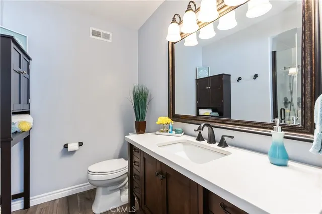 a bathroom with a sink a mirror and a shower