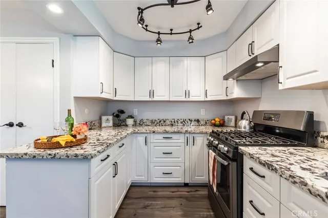 a kitchen with a stove and a sink