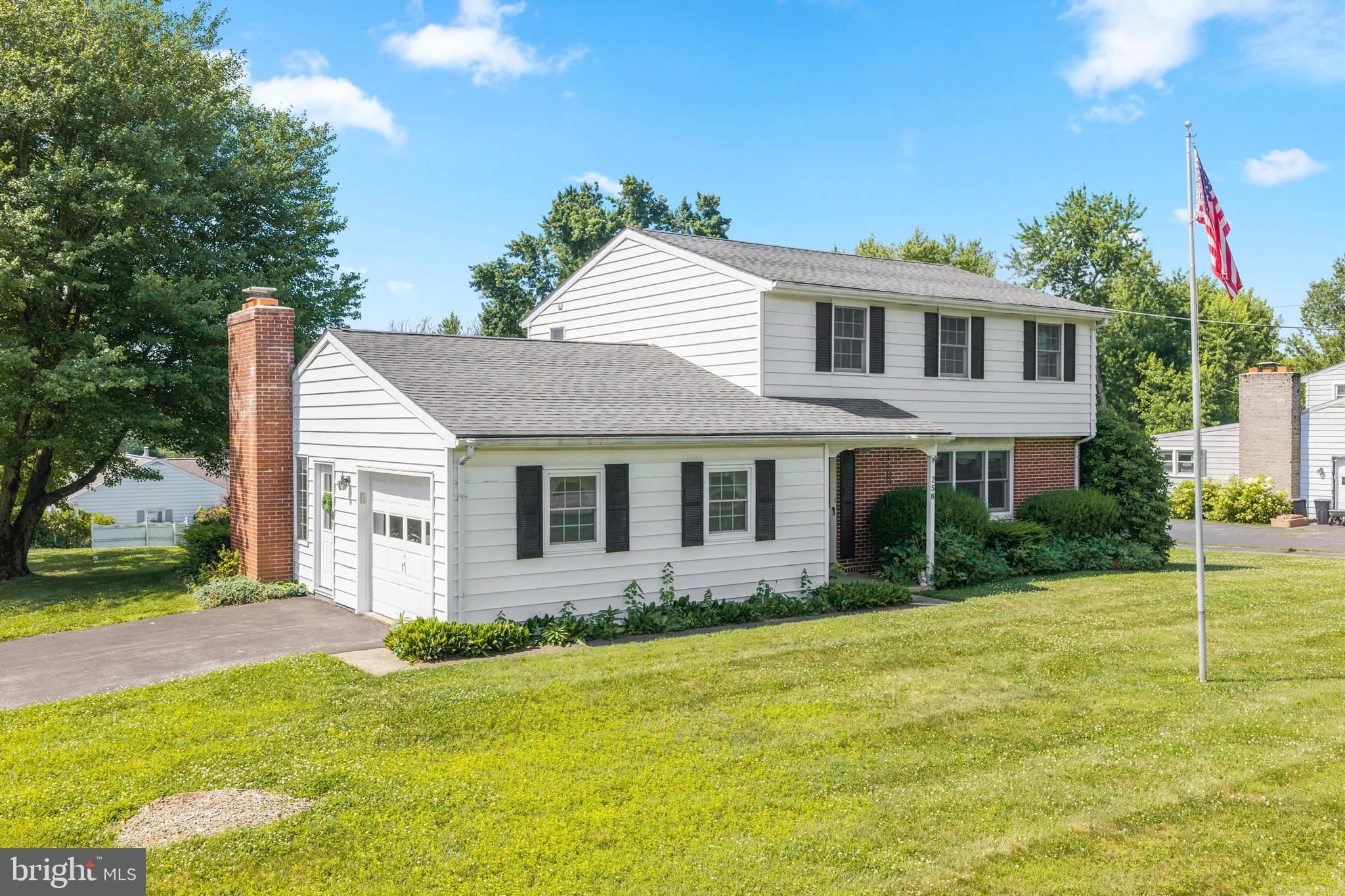 258 Monacy Road Coatesville, PA 19320 - Photo 52 of 54 a front view of a house with a garden