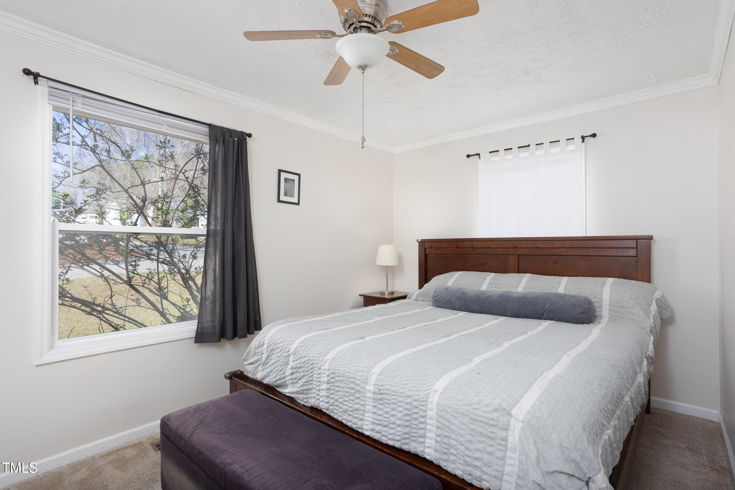 2701 Newbold Street Raleigh, NC 27603 - Photo 9 of 15 a bedroom with a bed and window