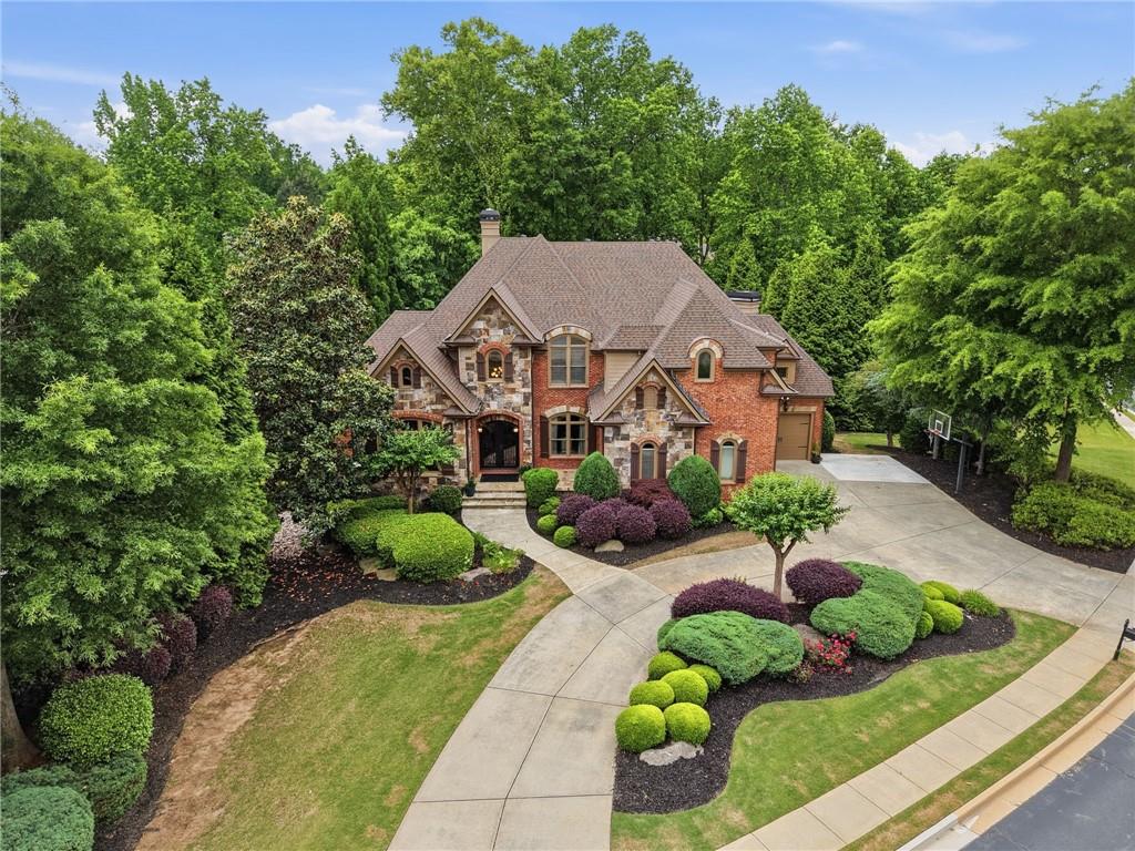 8340 Colonial Place Duluth, GA 30097 - Photo 74 of 74 a aerial view of a house with yard and green space