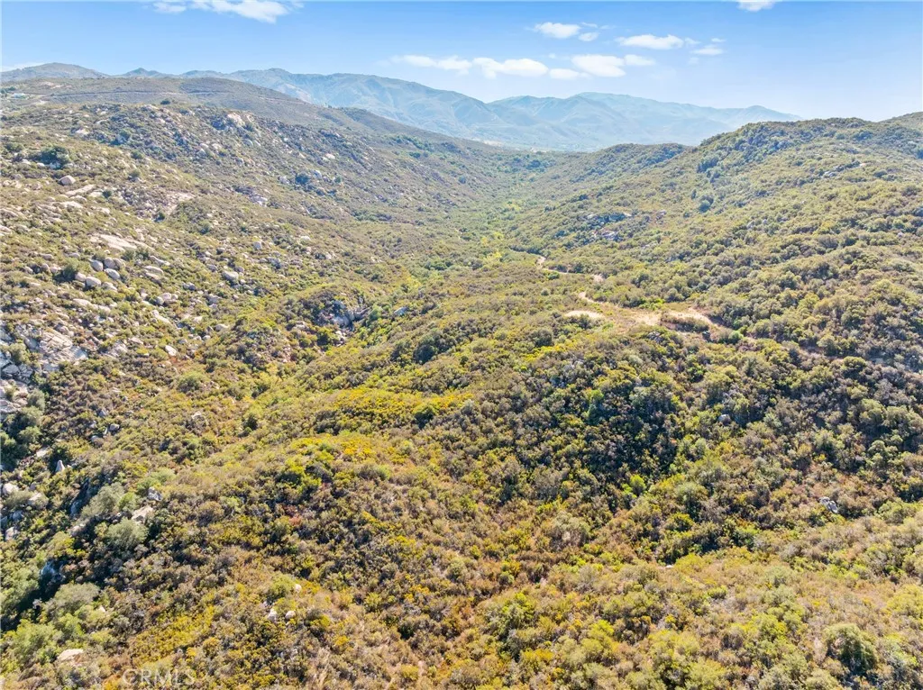 0 Pala Temecula Rd Valley Center Valley Center, CA 92082 - Photo 10 of 39 a view of a mountain range with a lush green hillside