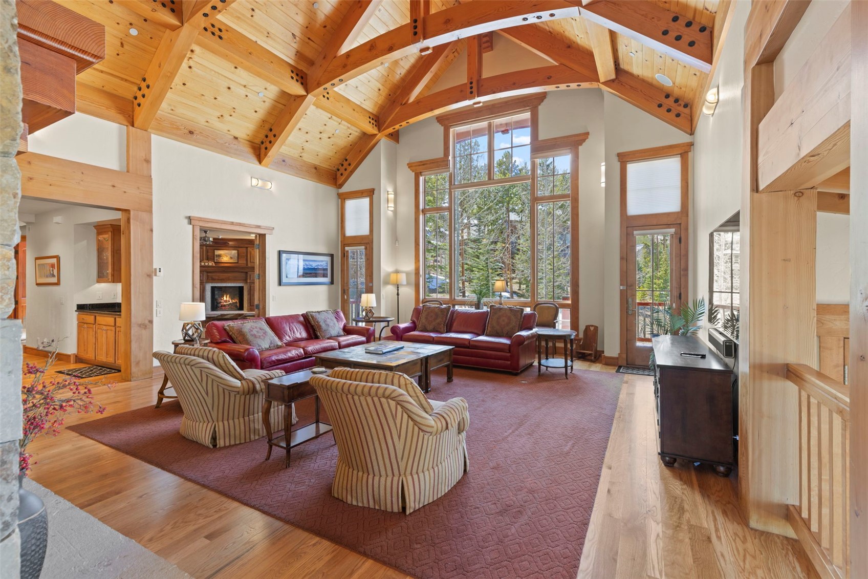 317 Timbertrail Road Breckenridge, CO 80424 - Photo 15 of 50 a living room with furniture a large window and wooden floor