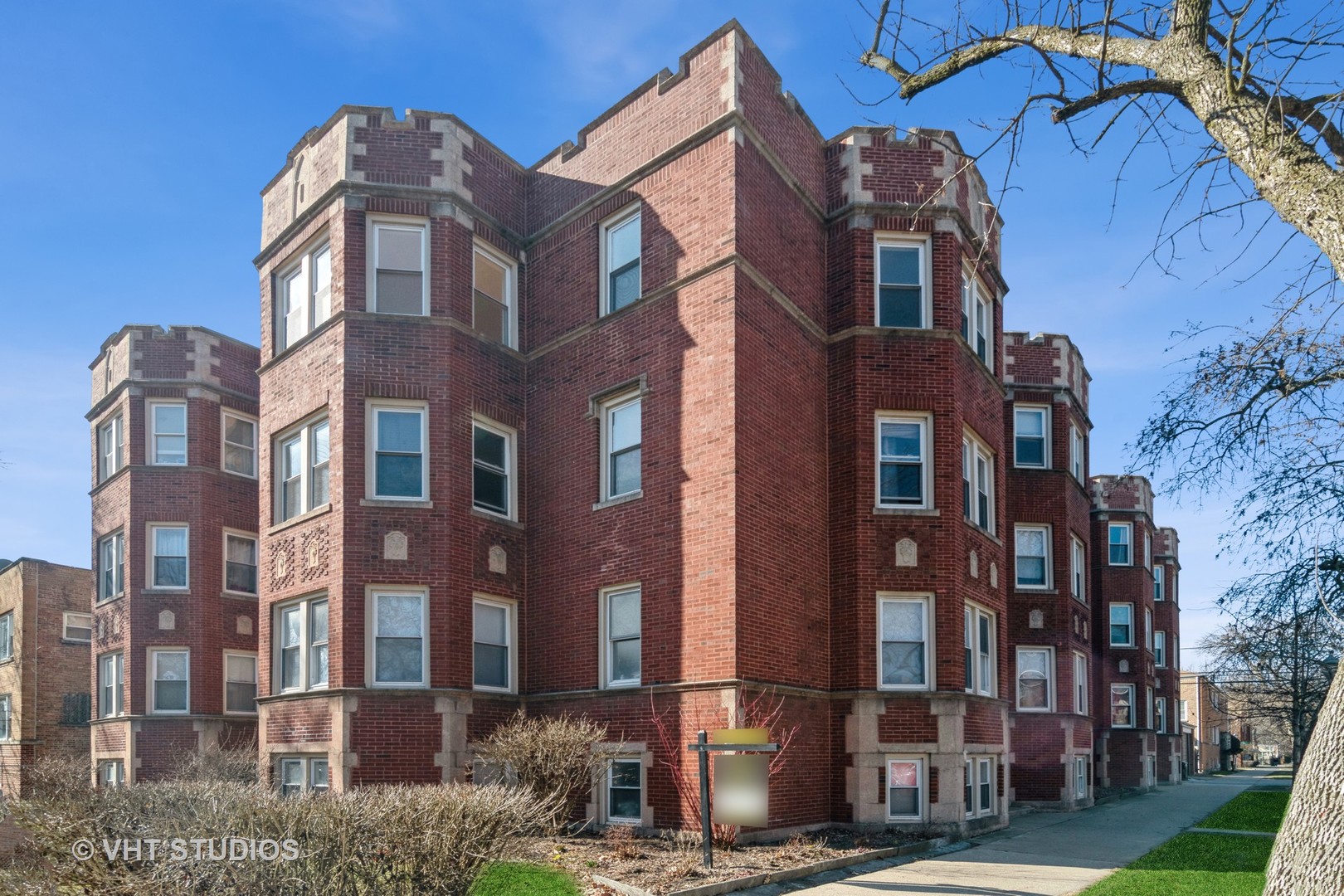 2901 West Arthur Avenue, Unit 3 Chicago, IL 60645 - Photo 2 of 13 a front view of a residential apartment building with a yard