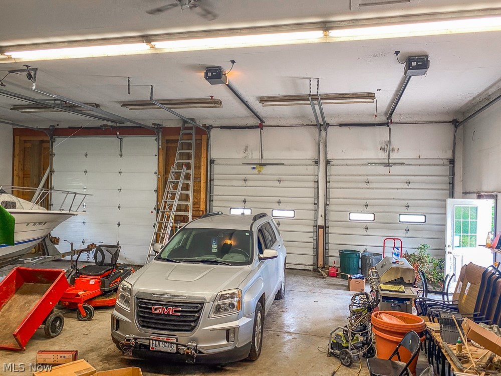 17499 Kinsman Road Middlefield, OH 44062 - Photo 46 of 49 Garage featuring a garage door opener
