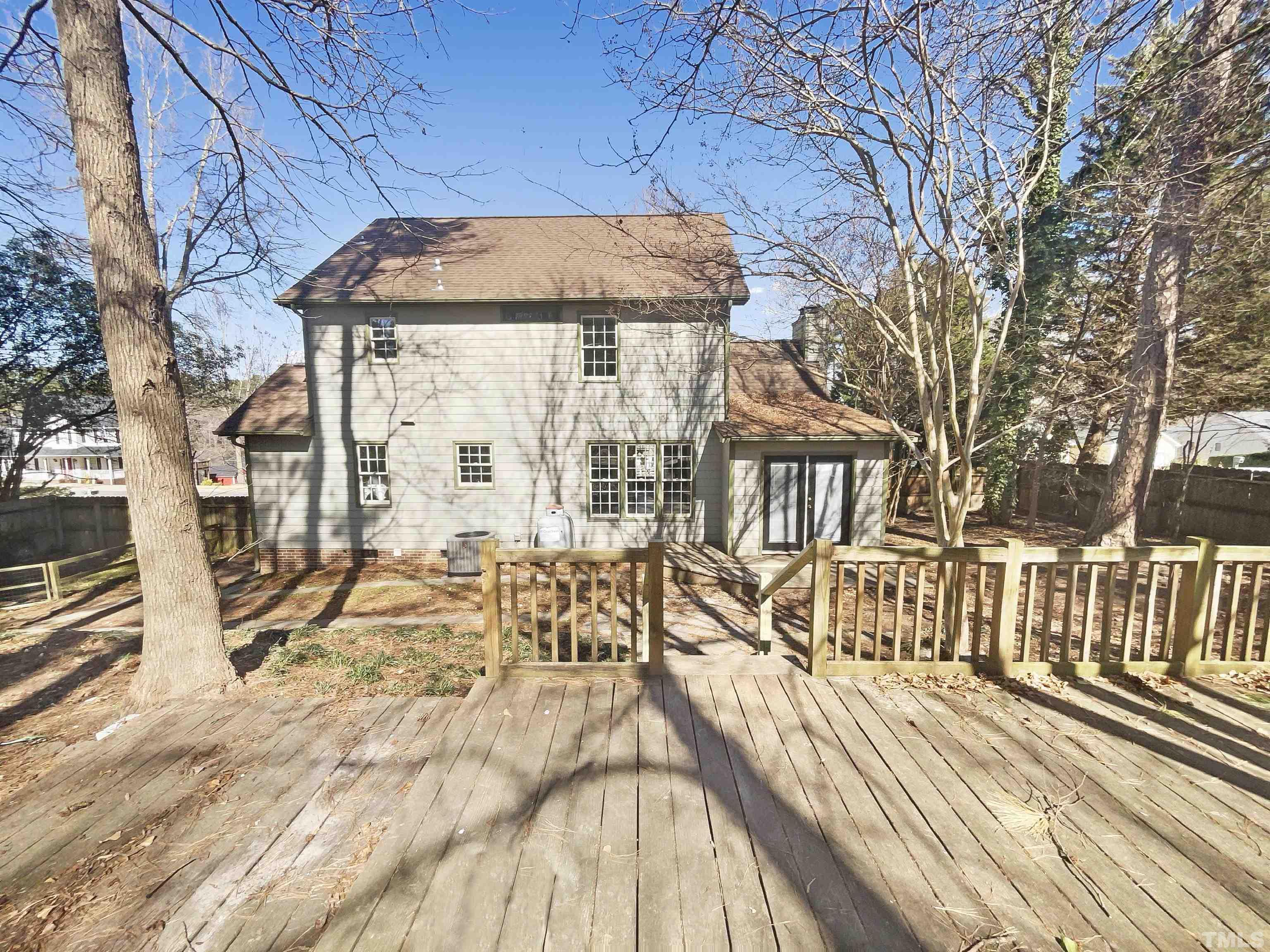 4320 Willow Lake Road Raleigh, NC 27616 - Photo 7 of 21 a view of a patio with table and chairs and wooden floor