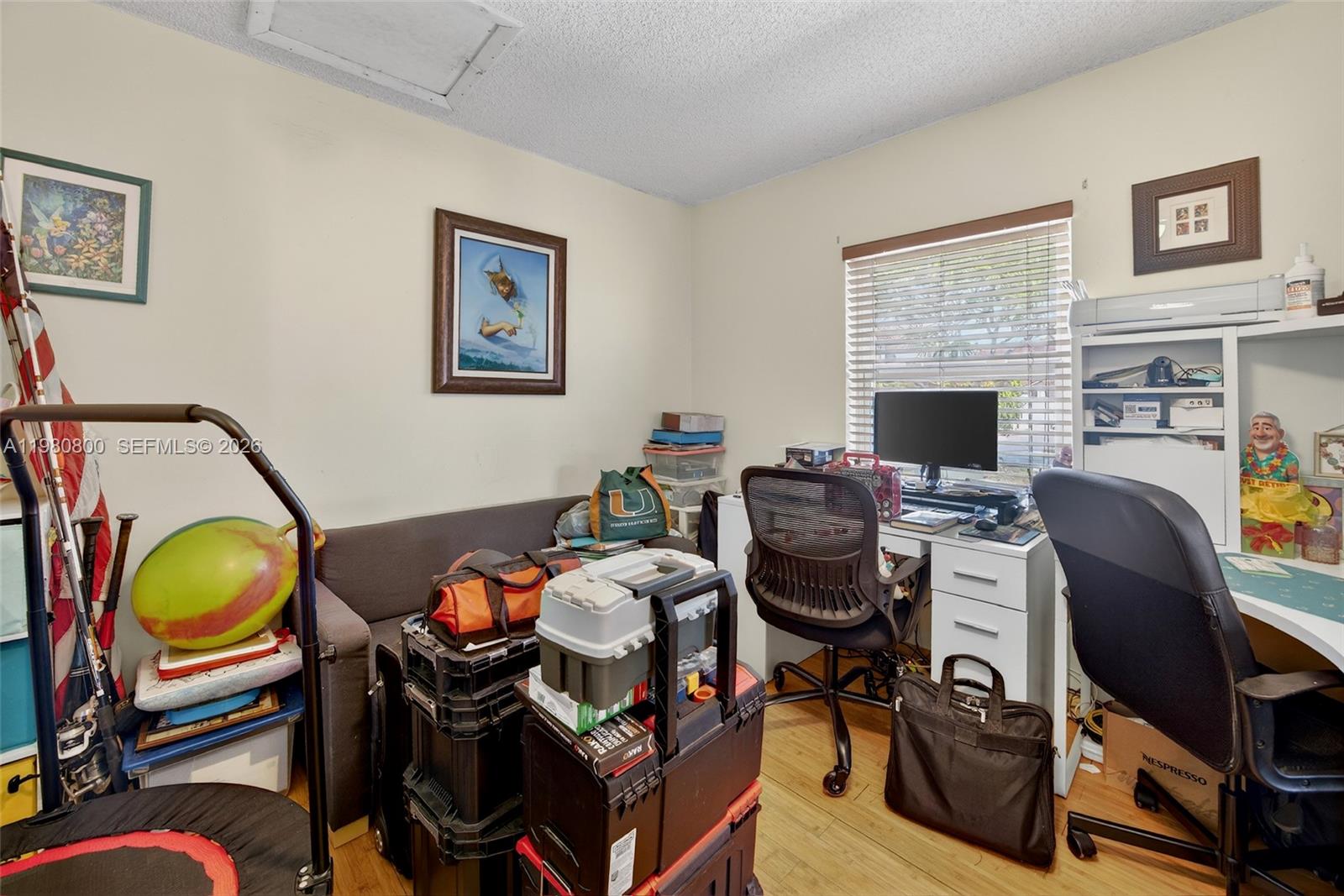 15260 Southwest 57th Street Miami, FL 33193 - Photo 12 of 22 a view of a workspace with furniture and a workspace