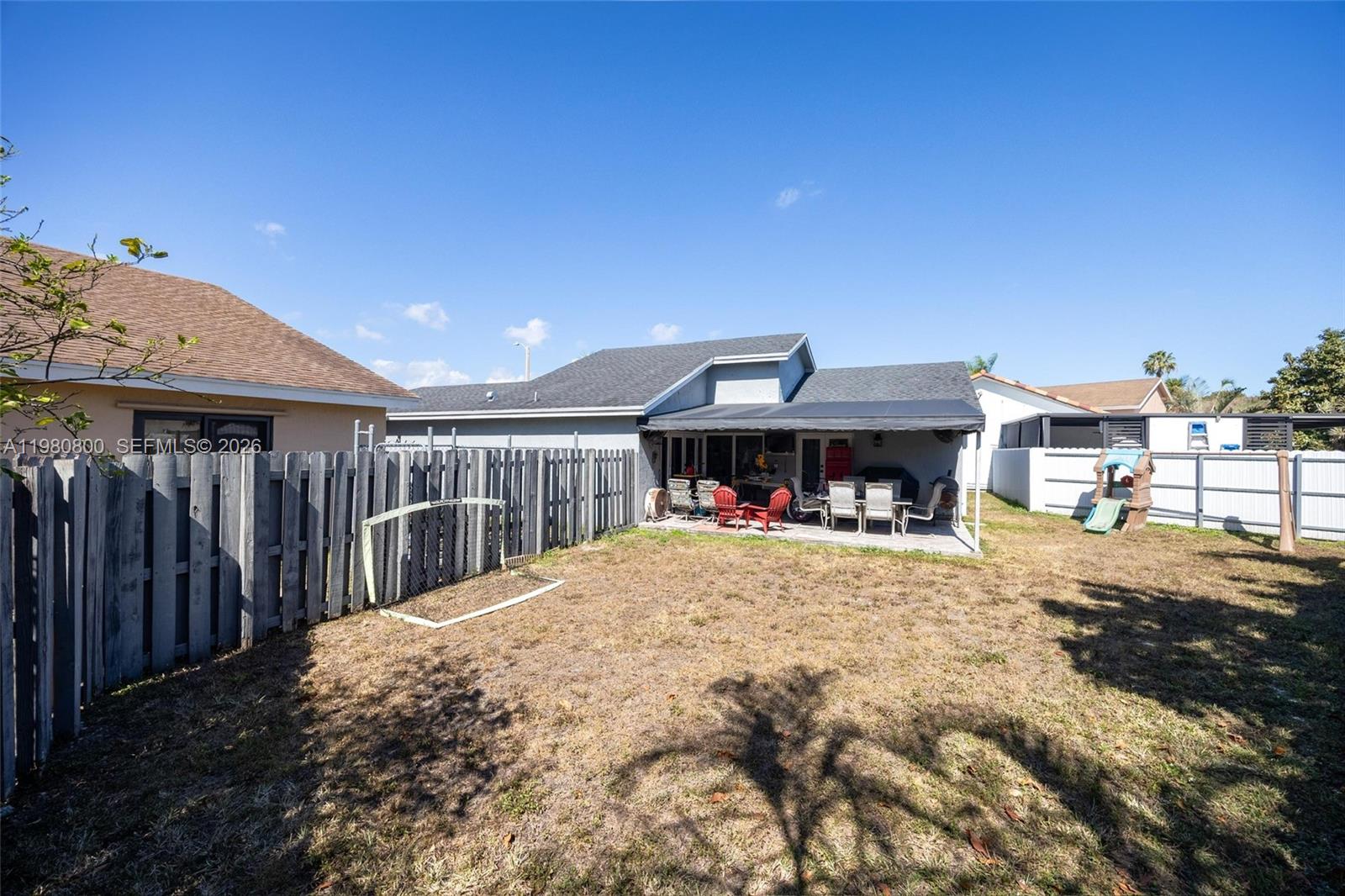 15260 Southwest 57th Street Miami, FL 33193 - Photo 18 of 22 a view of a house with wooden deck and a outdoor
