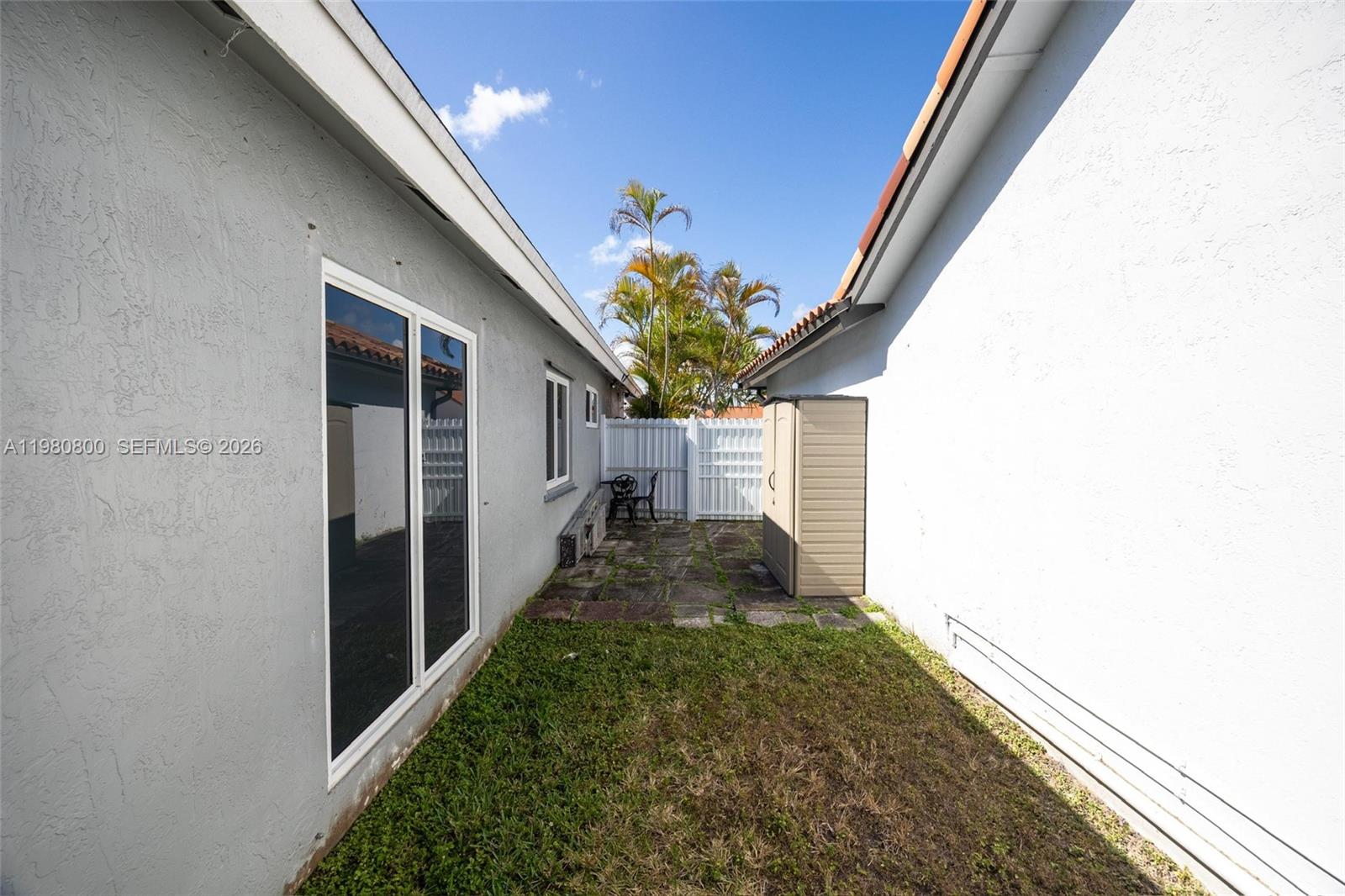 15260 Southwest 57th Street Miami, FL 33193 - Photo 19 of 22 a view of a house with a yard