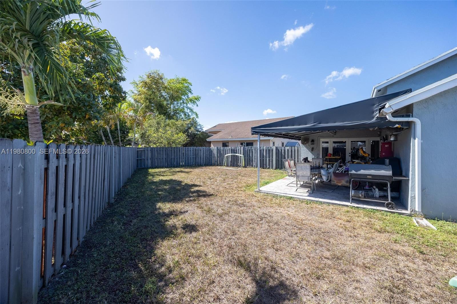 15260 Southwest 57th Street Miami, FL 33193 - Photo 21 of 22 a swimming pool with wooden fence