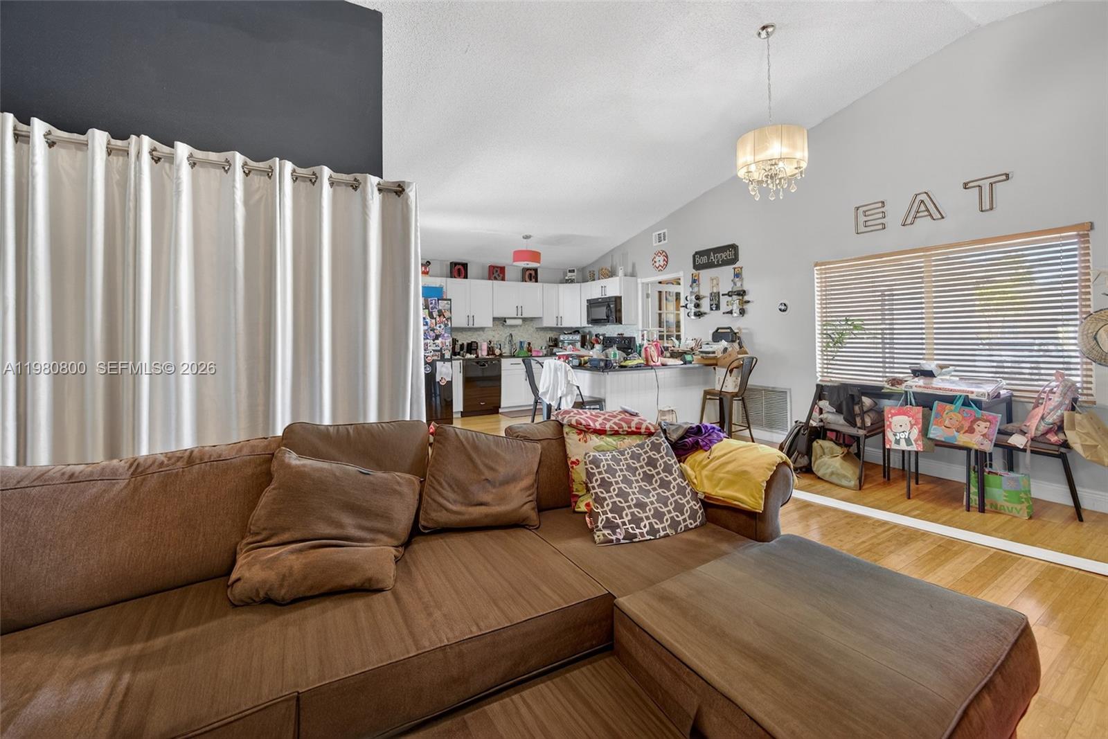15260 Southwest 57th Street Miami, FL 33193 - Photo 6 of 22 a living room with furniture and a large window