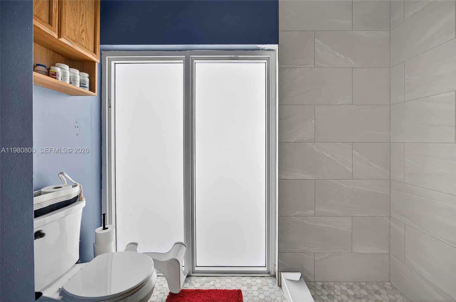 15260 Southwest 57th Street Miami, FL 33193 - Photo 10 of 22 a bathroom with a sink toilet and shower