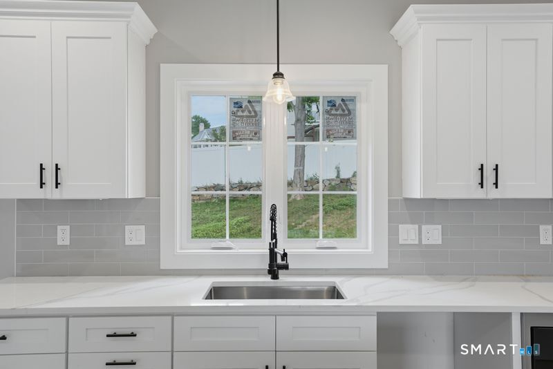 796 Maple Hill Road Naugatuck, CT 06770 - Photo 5 of 35 a kitchen with a sink and a window