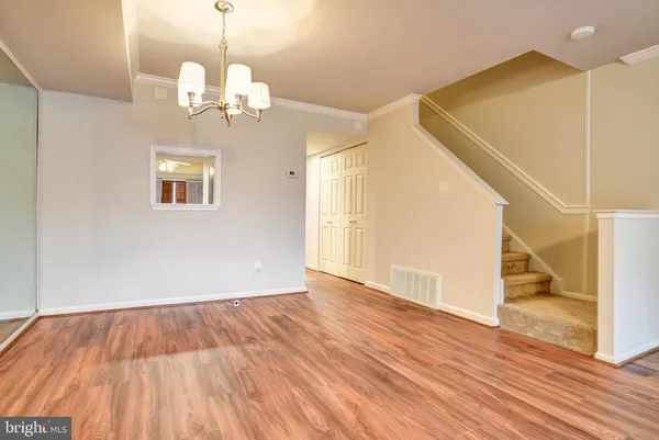 a view of a livingroom with wooden floor