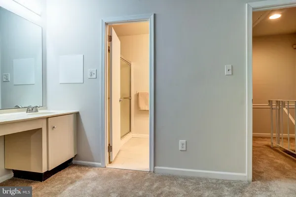 a view of a bathroom with mirror